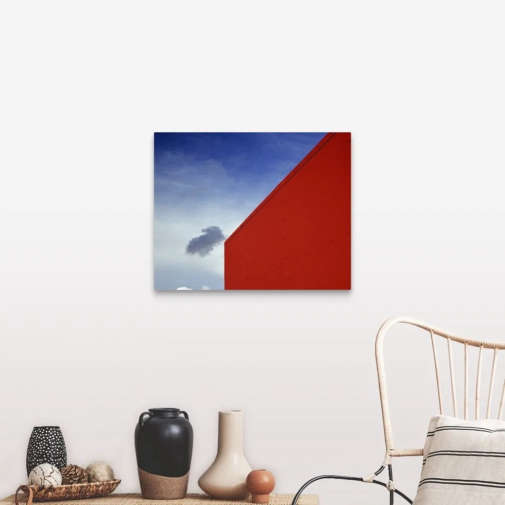 "A shadowed cloud floating through blue sky over the red corner of James John " Canvas Wall Art