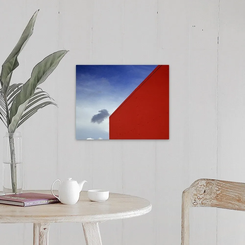 "A shadowed cloud floating through blue sky over the red corner of James John " Canvas Wall Art